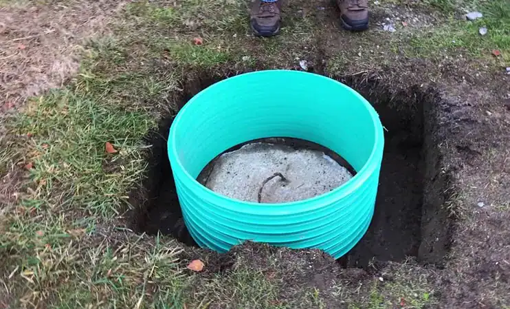 Plumber-Installing-Outdoor-Septic-Tank-Riser-In-Ground