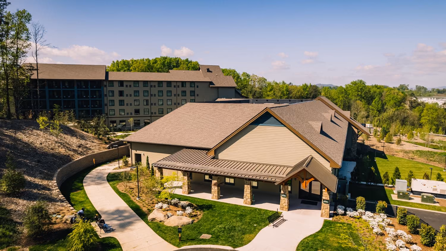 Hospitality building with a covered entrance and landscaped grounds at D&S Builders.