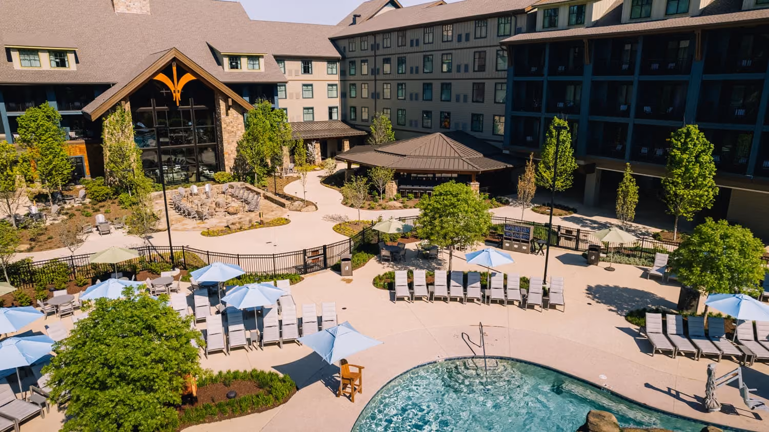Courtyard pool and lounge area at a D&S Builders hospitality property