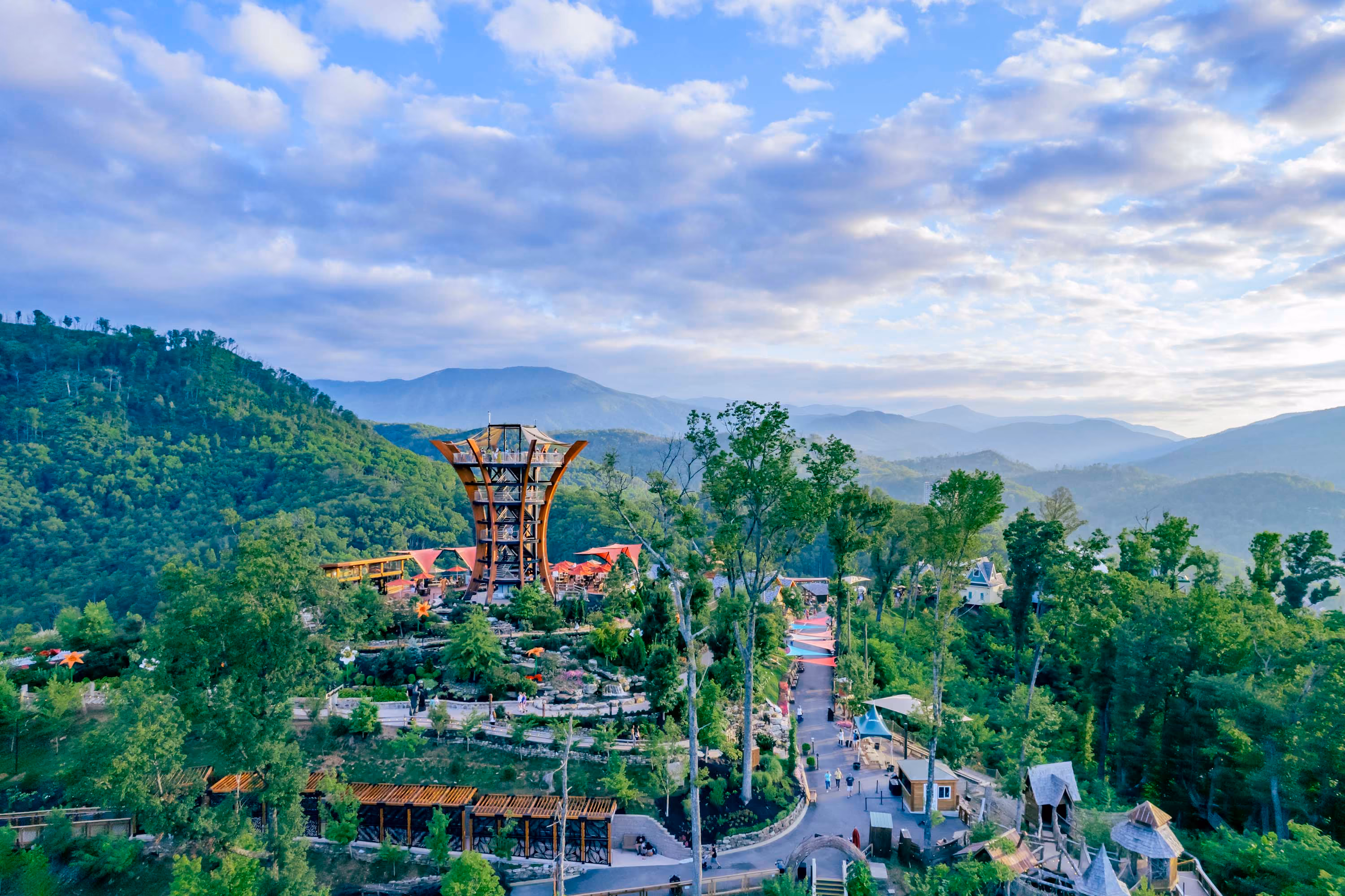 Scenic mountain overlook with a tall wooden tower and winding paths in Gatlinburg, Tennessee