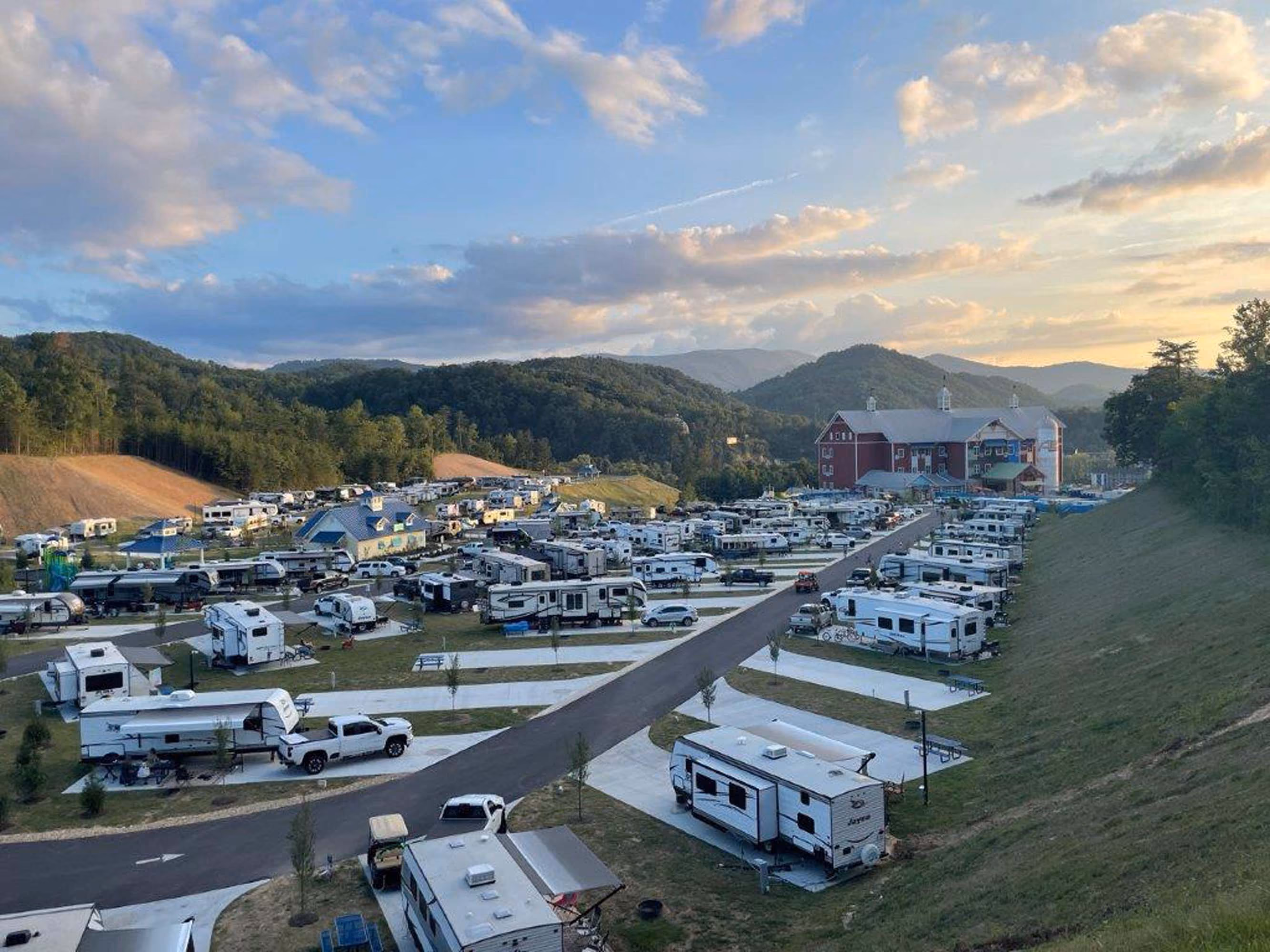 RV park with many campers and a lodge in the mountains at sunset, D&S Builders hospitality construction site