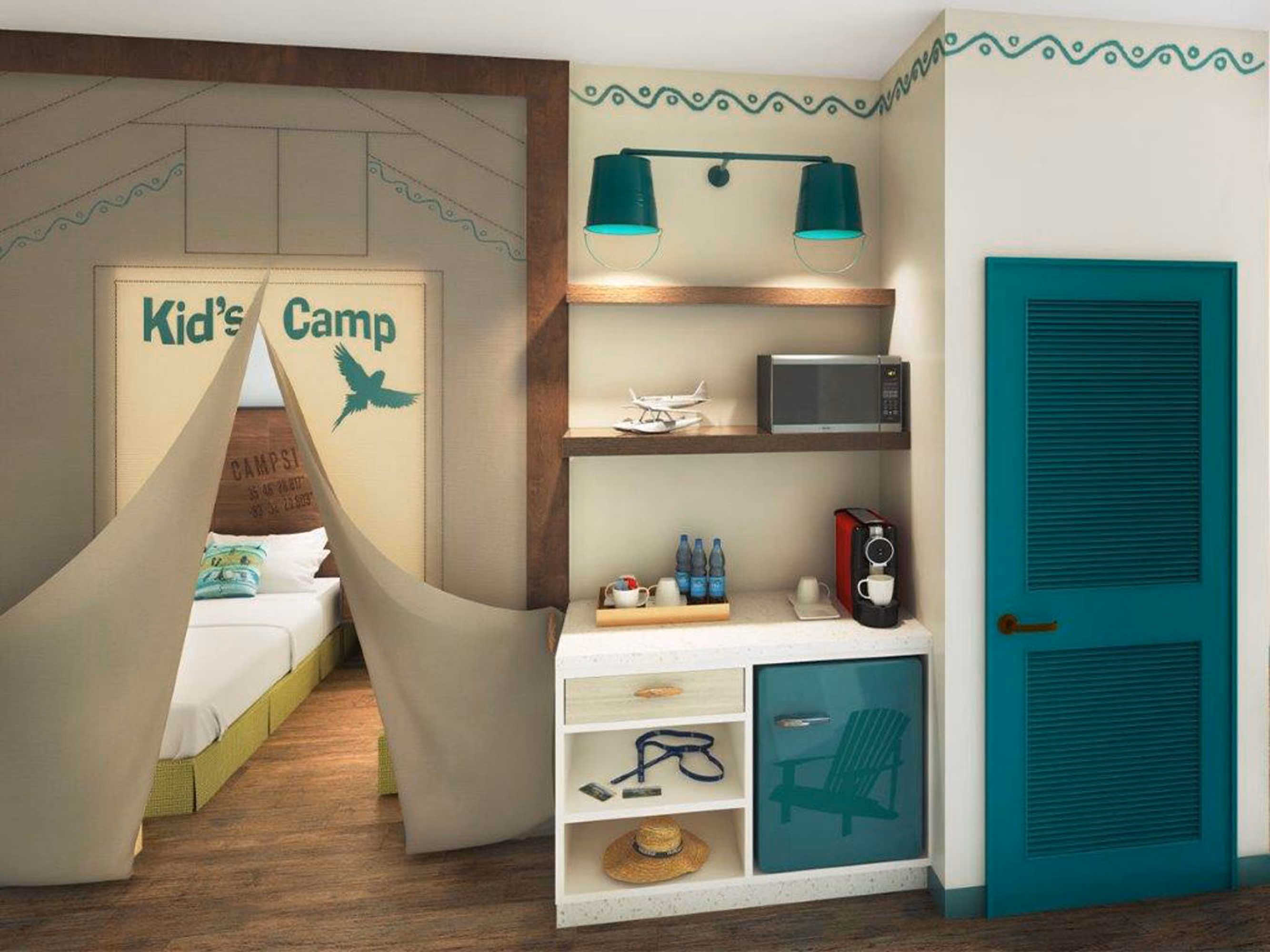 Kids' camp-themed hotel room with tent-style bed nook and teal kitchenette