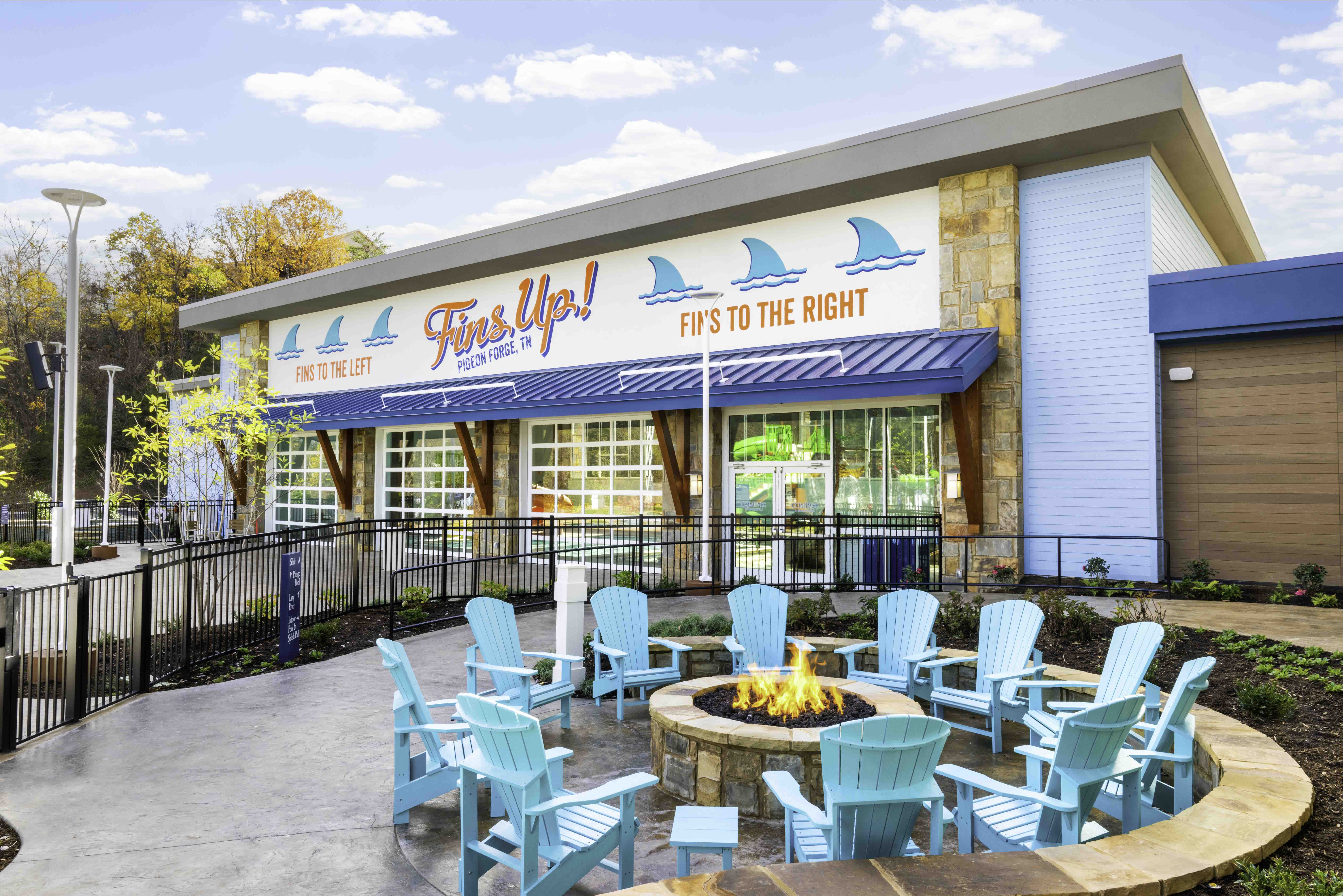 Outdoor seating area with fire pit outside a Pigeon Forge hospitality building