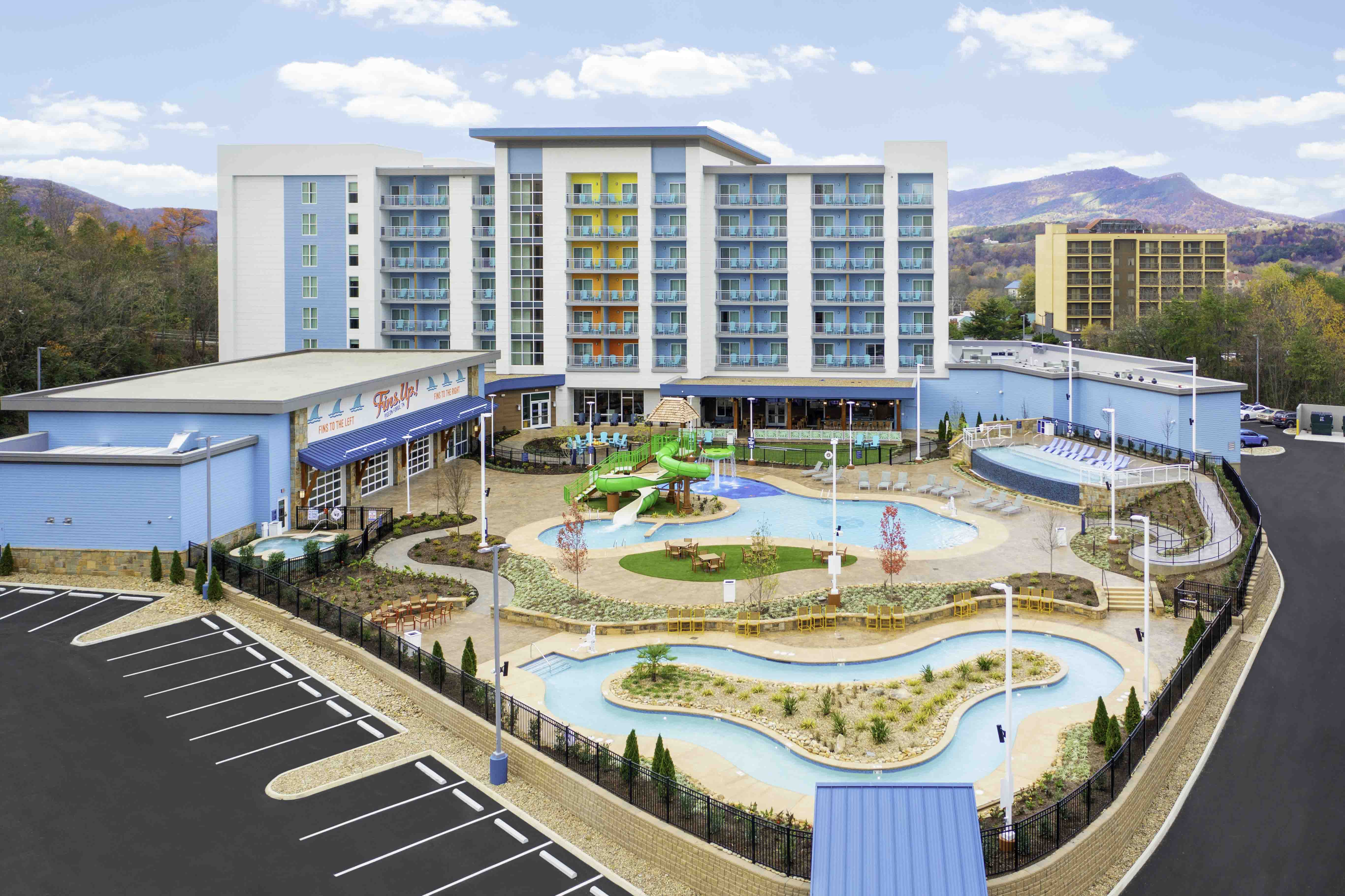 Hospitality construction project with a hotel, pool area, and mountain backdrop in Gatlinburg