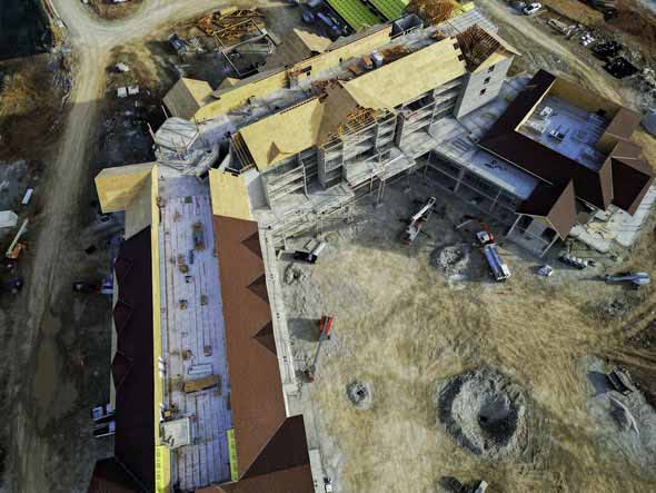 Aerial view of a large hospitality construction site with multiple buildings under construction