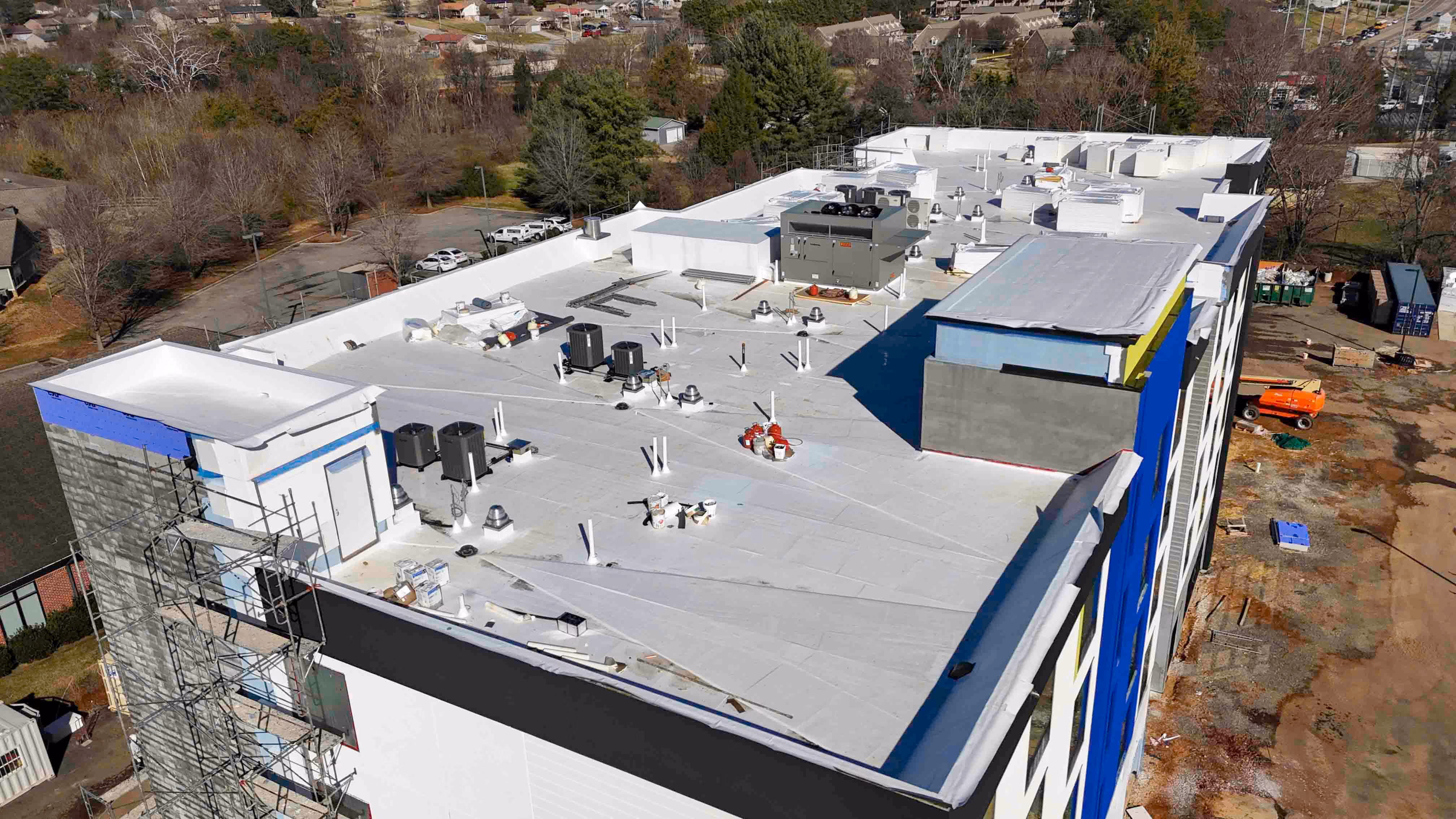 Aerial view of a large building with a flat roof under construction in Knoxville
