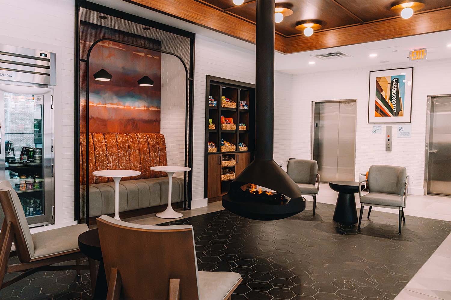 Indoor fire pit and seating area in the Holiday Inn Express by D&S Builders.