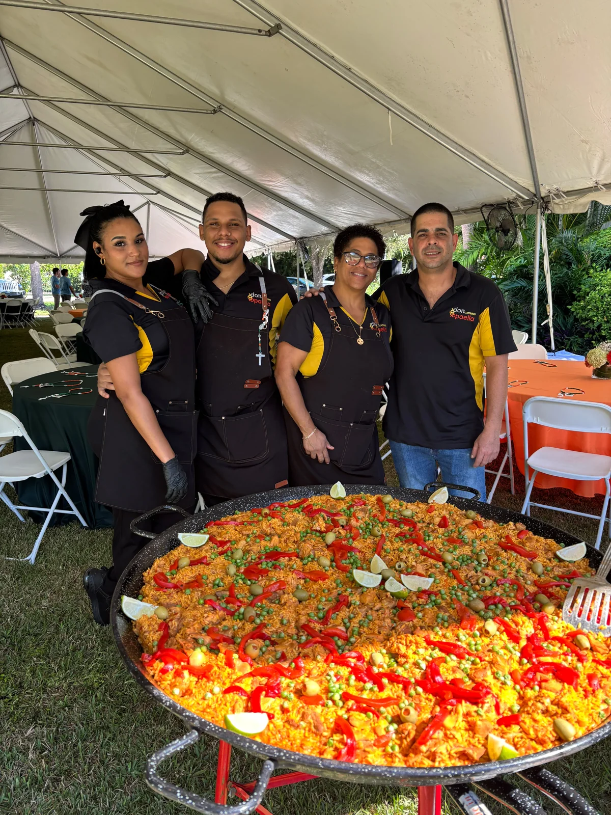 Don Paella team with a freshly cooked paella at St. Augustine Church.