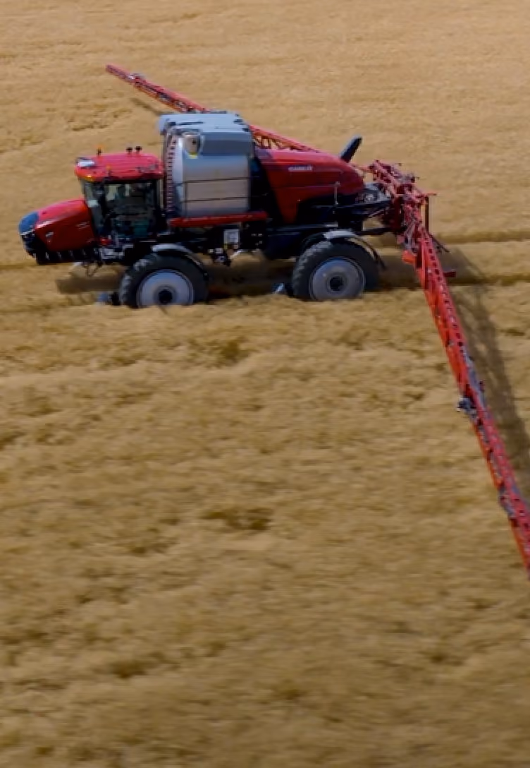 Trailer being plowed in a wheat field