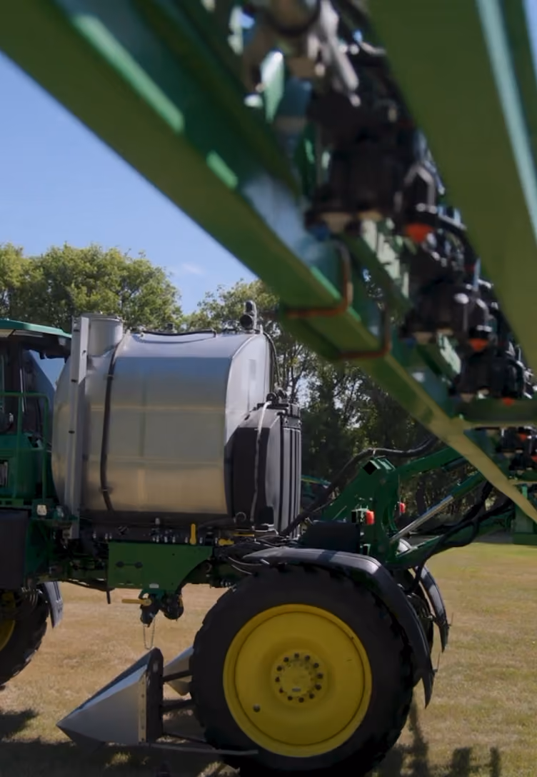 Spray Attachment on a tractor in a wheat field