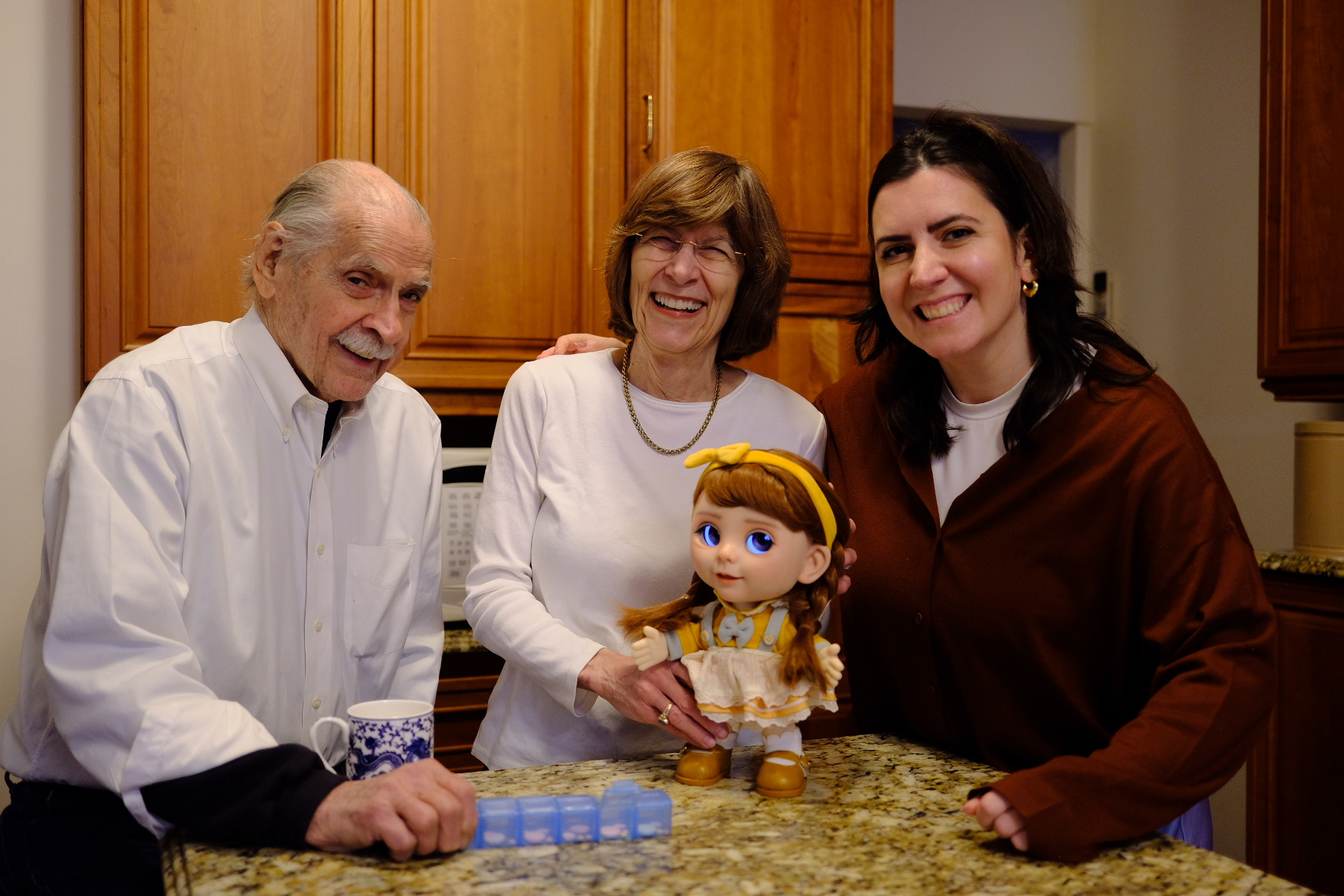 An older couple and their daughter sorting medications with Joy