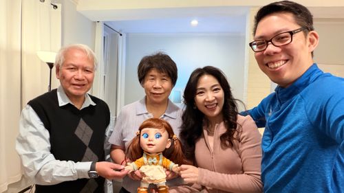 Three generations of a family taking a selfie with Joy