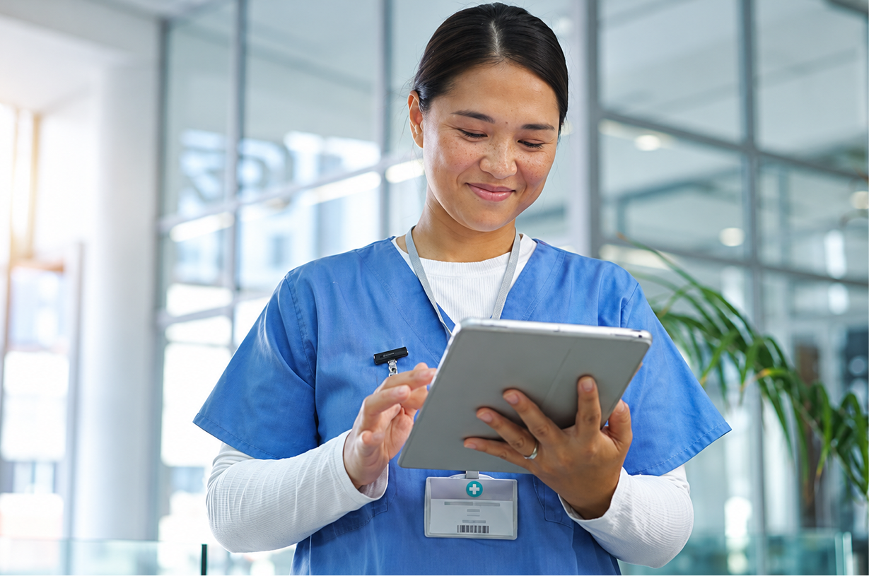 Nurse logging care in CareSphere on a tablet