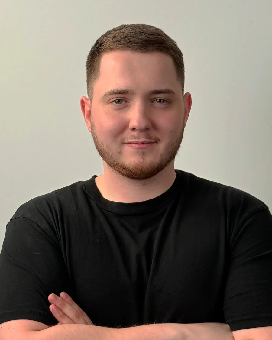 Lazar Ćulibrk, CEO of CuliFlow, arms crossed, in a black T-shirt