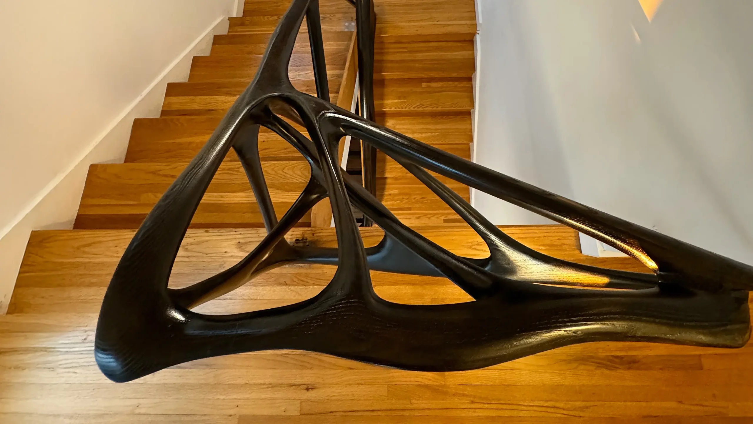Sculptural solid wood staircase and handrail handcrafted in Los Angeles by Amorph Studio