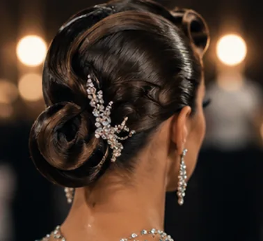 Sculpted ballroom competition updo with hair jewelry