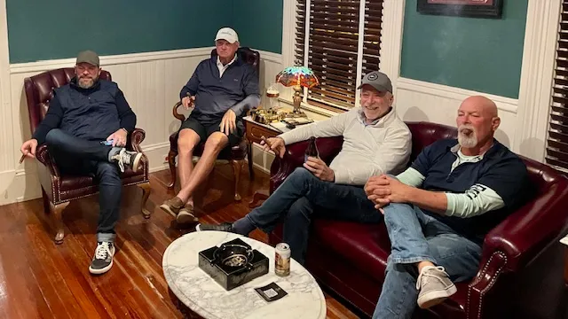 Guests enjoying an evening together in the parlor