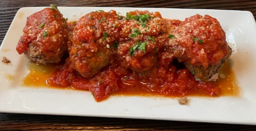 Meatballs in tomato sauce with grated cheese