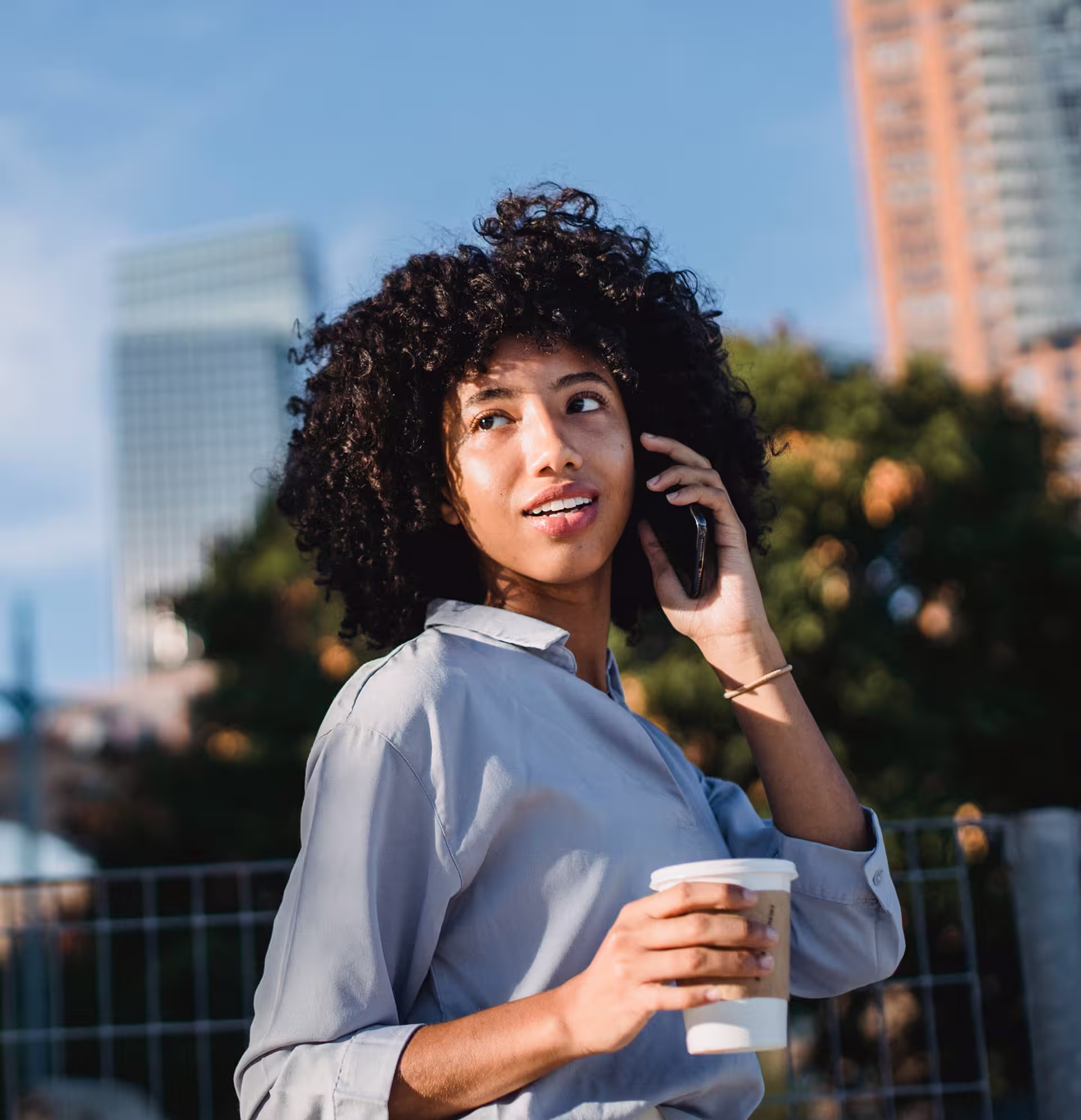 A woman is talking on the phone.