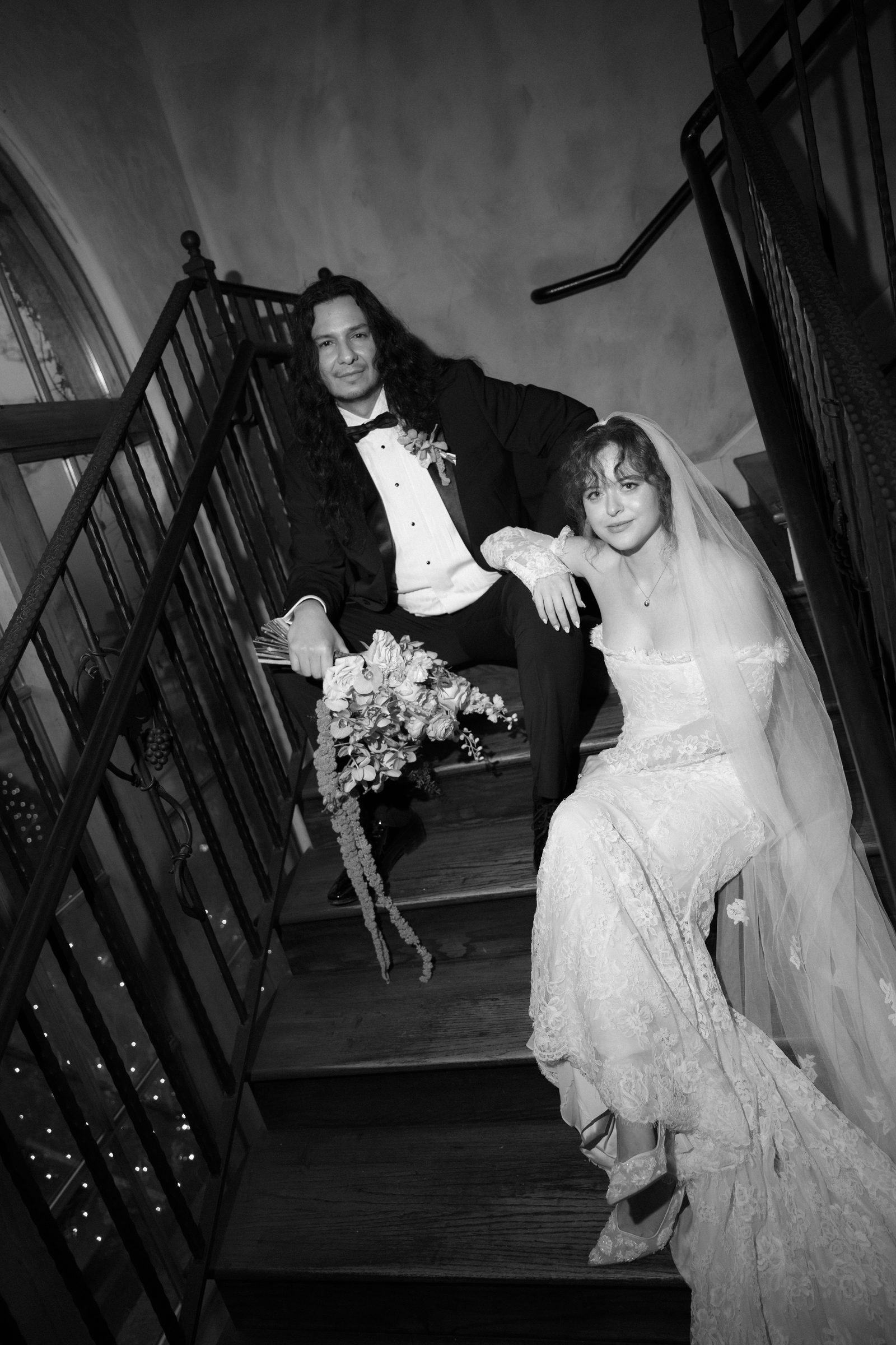 Kyja and Alex on the staircase, black and white