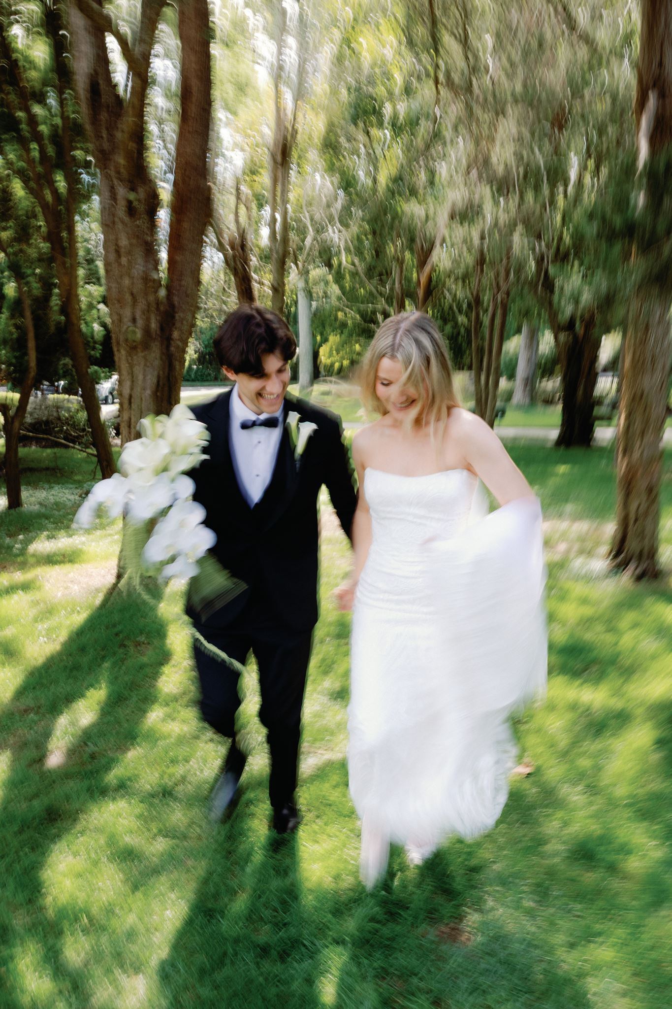 Caitlin and Greg walking through the trees