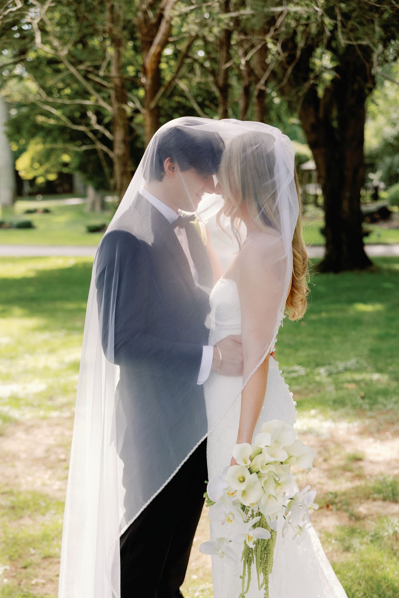 Caitlin and Greg under the veil