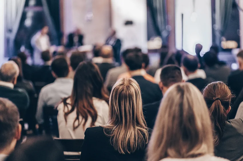 An audience listening at a training session