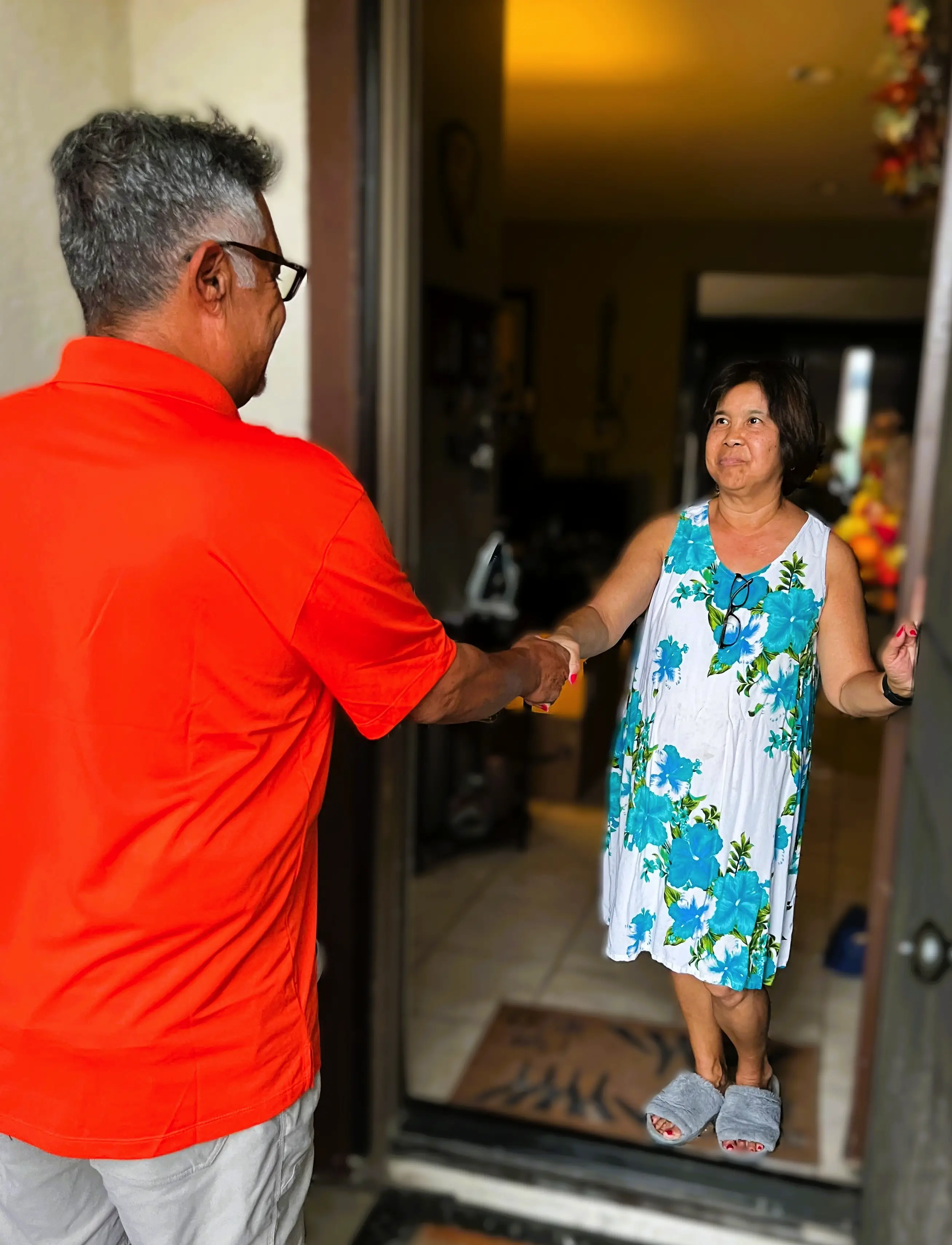 Horizon Window Care technician greeting a homeowner at her front door in Murrieta