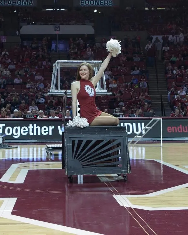 Featuring an OU dancer in the halftime show at an Oklahoma Sooners basketball game