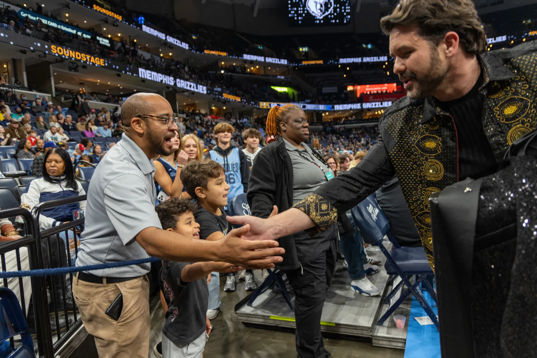 Greeting fans courtside at a Memphis Grizzlies game