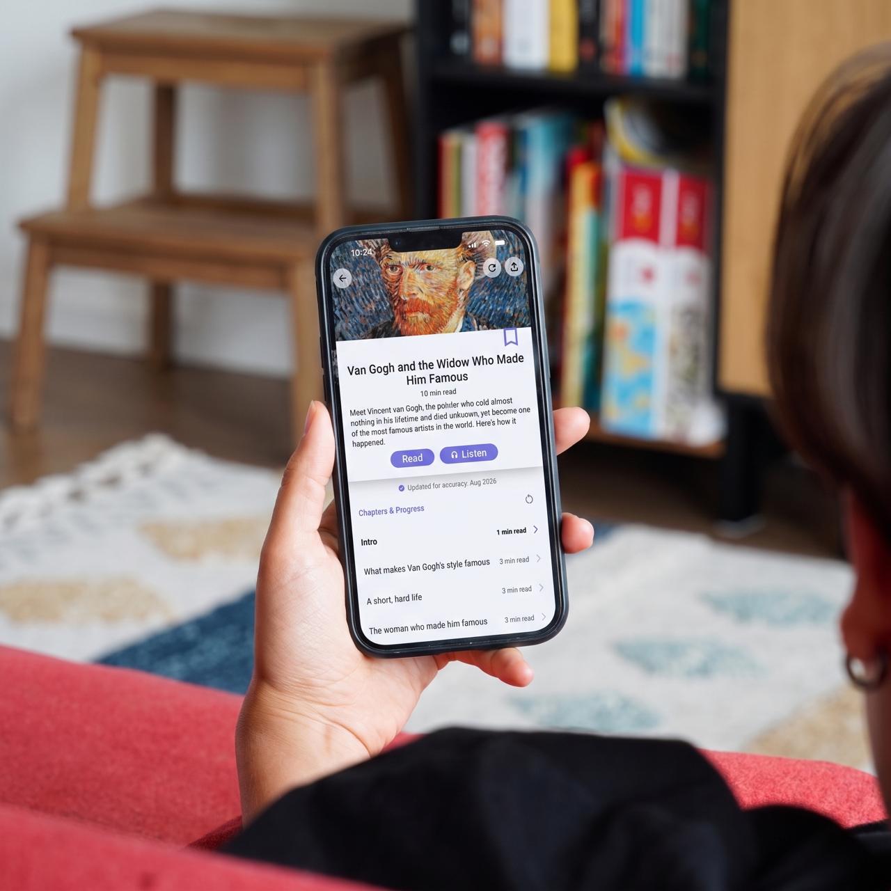 Person on a sofa holding a phone with the Nerdish article "Van Gogh and the Widow Who Made Him Famous"