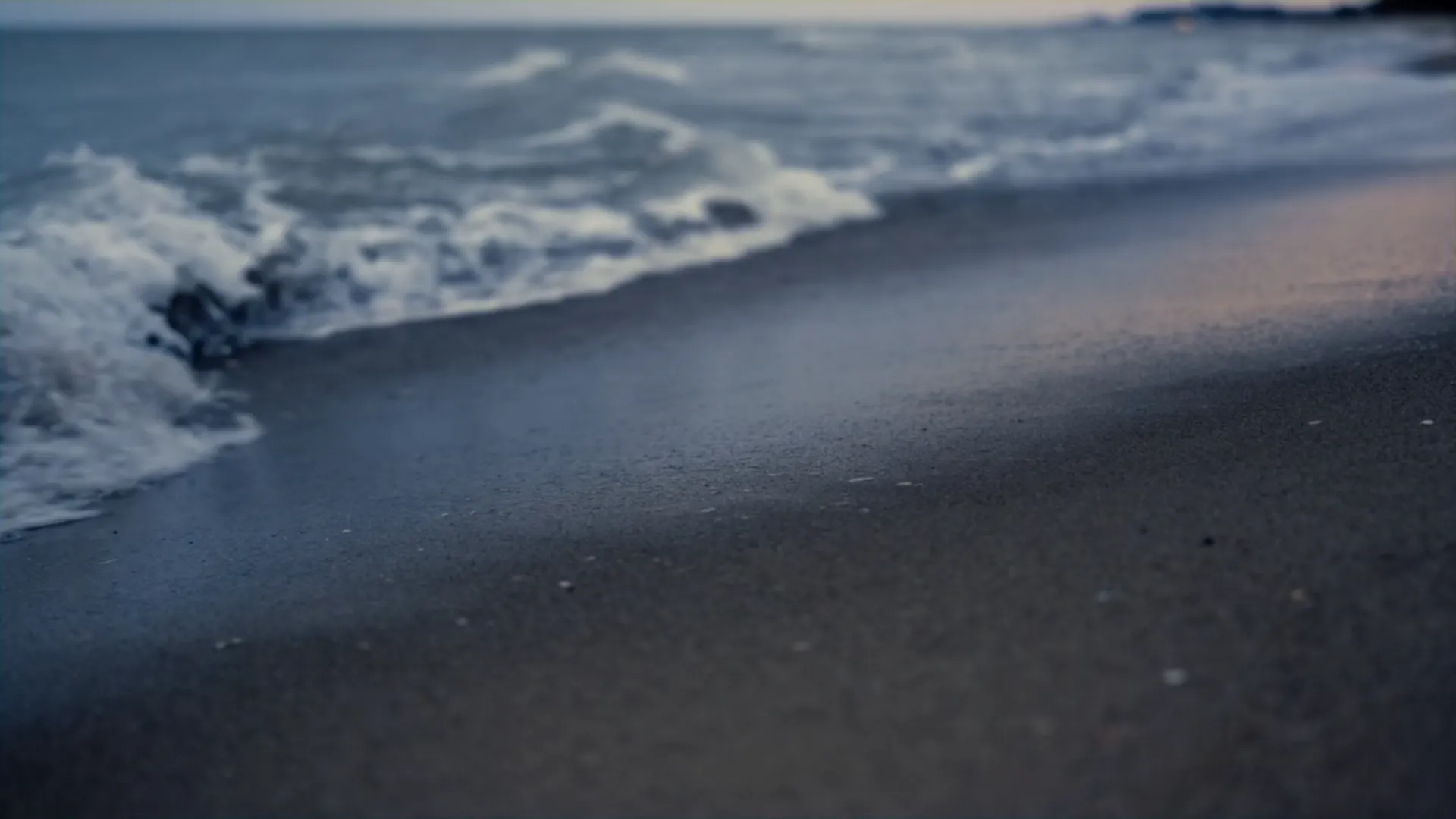 Waves at dusk on a quiet Gulf shoreline, private concierge service Dubai