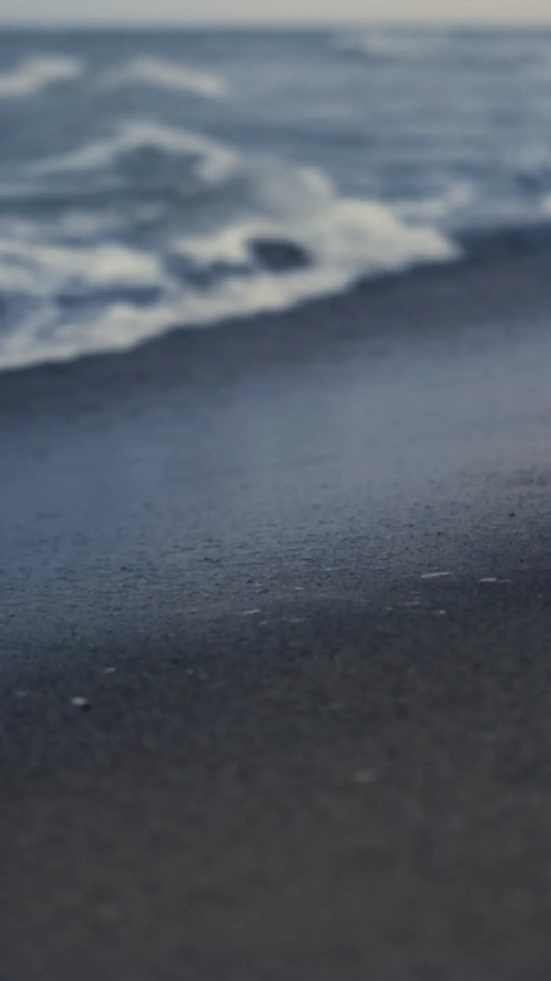 Waves at dusk on a quiet Gulf shoreline, private concierge service Dubai