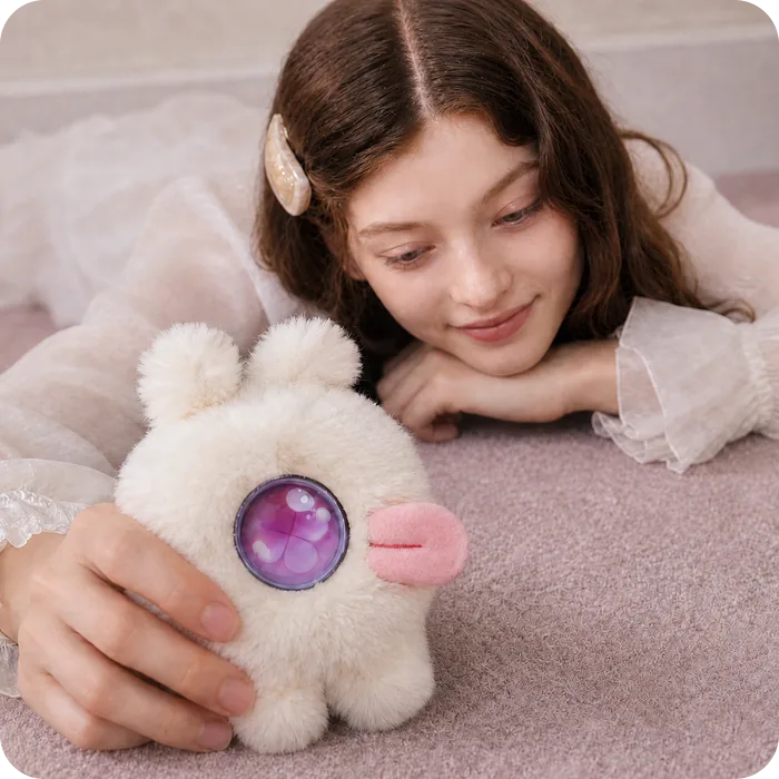 A Mumuland companion on a bed