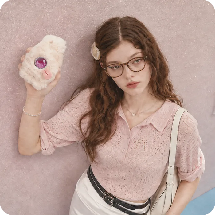 A girl holding her Mumuland companion at home
