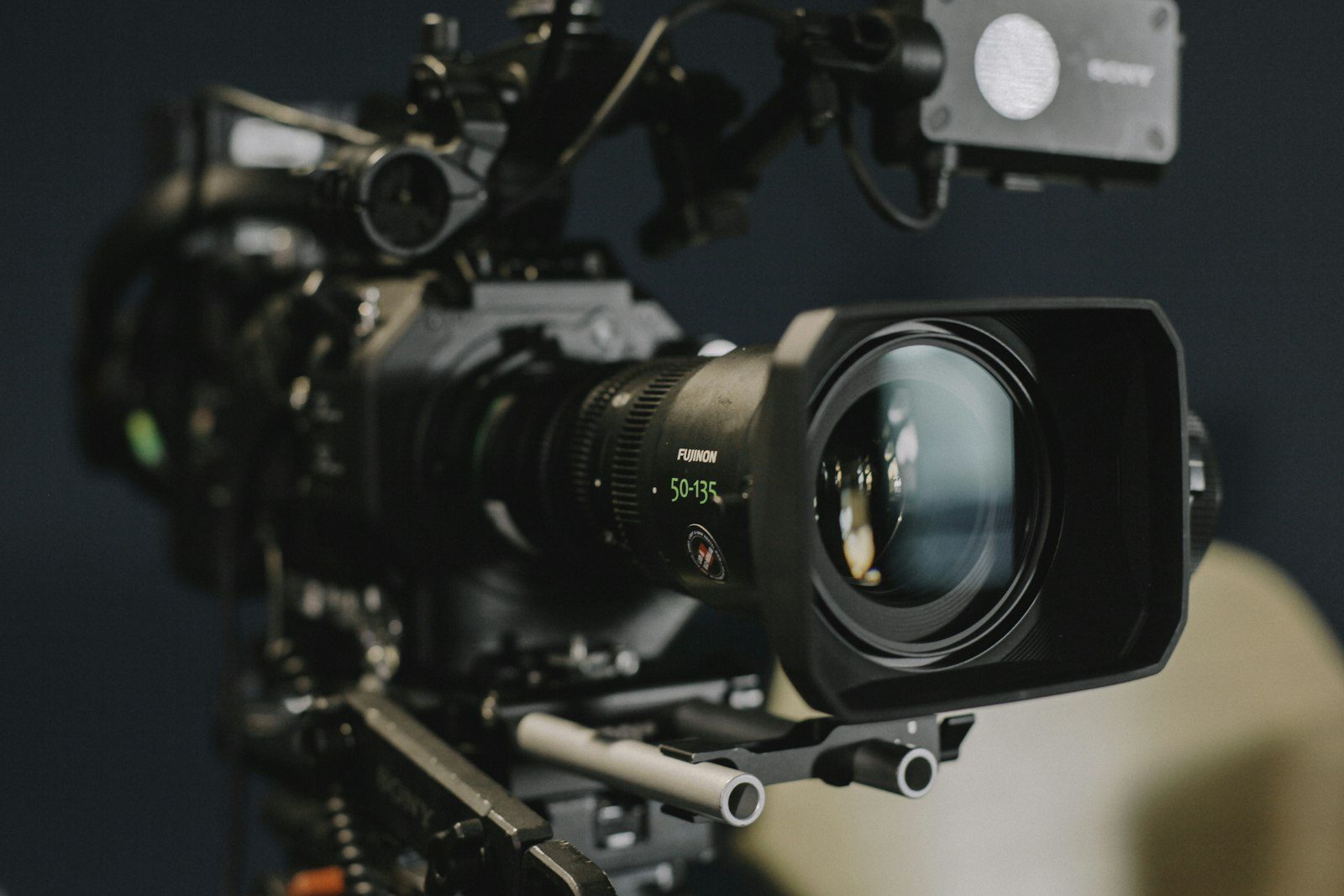 A cinema camera on a dark film set