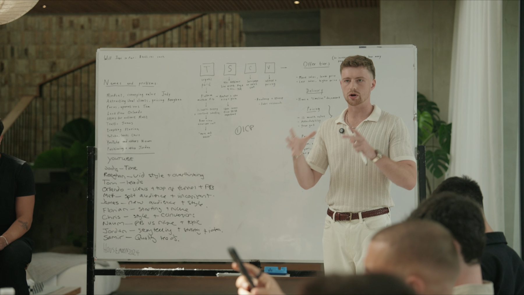 Oscar Owen running a strategy session at a whiteboard