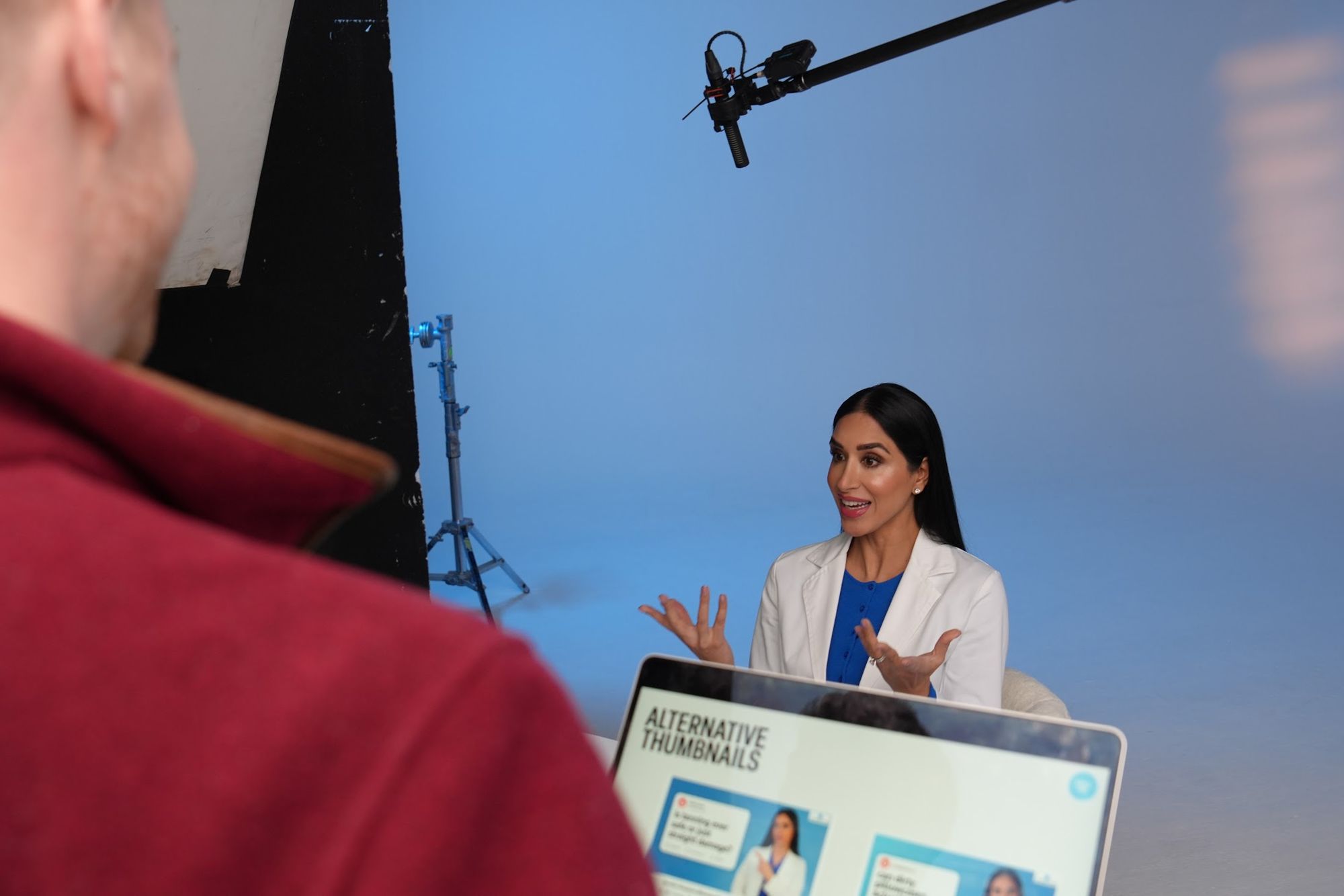 Reviewing alternative thumbnail options on set while Dr Raj films