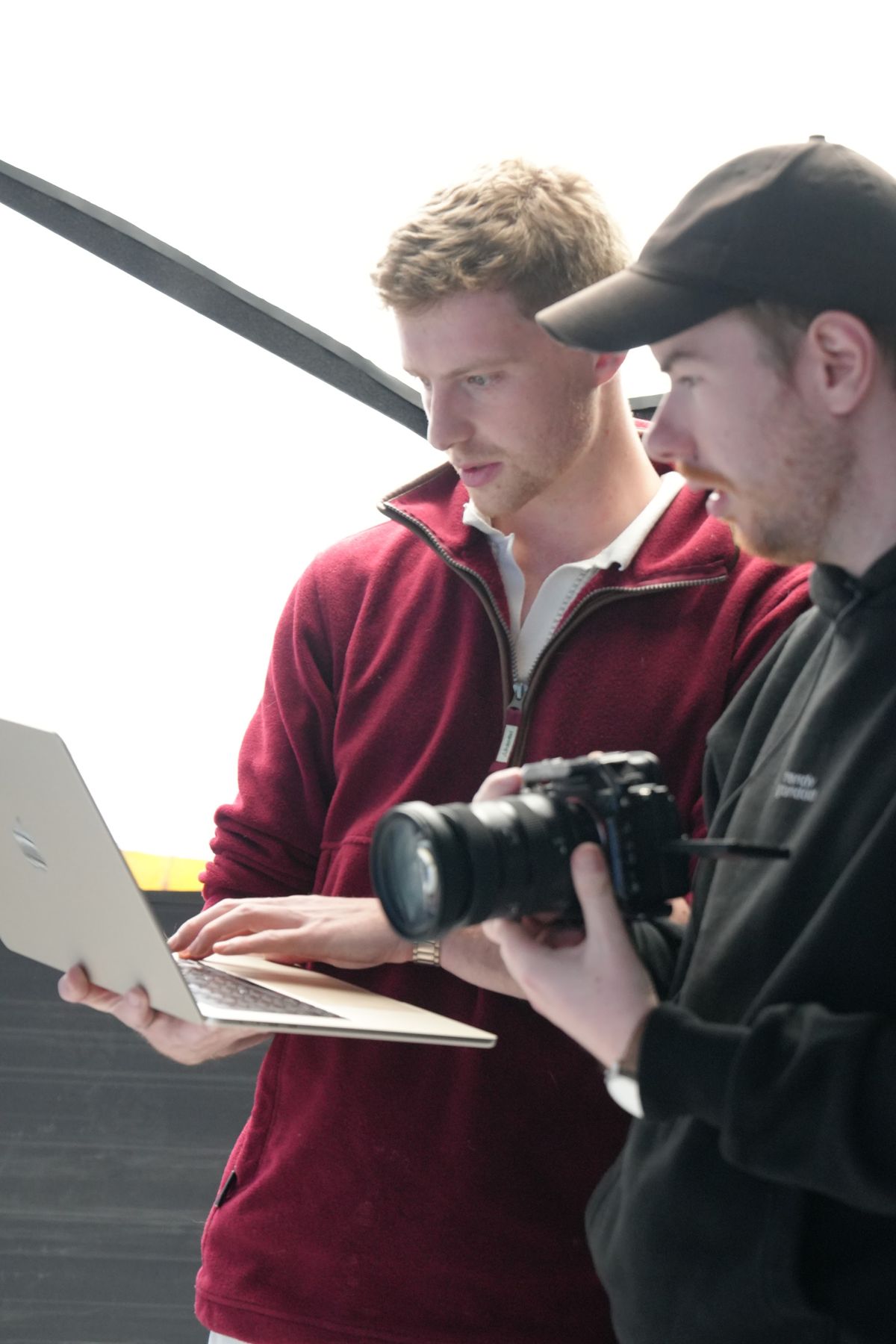 Reviewing shots on a laptop and camera during the shoot