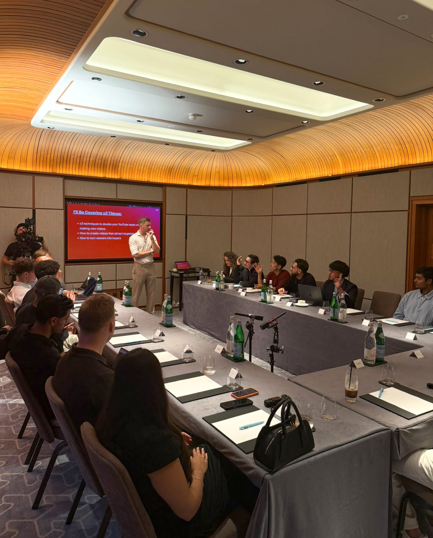 Marketing leaders seated around a conference table during a strategy workshop