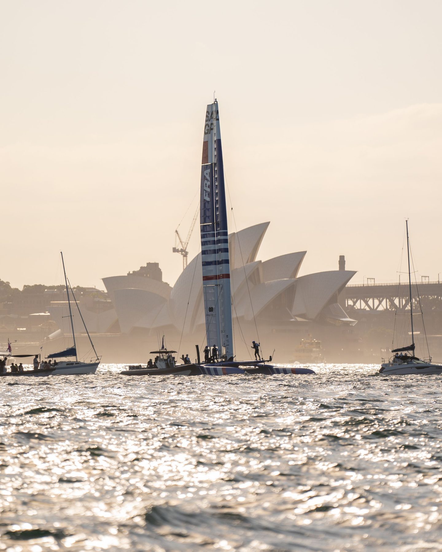 A France F50 silhouetted against the Sydney Opera House at sunset