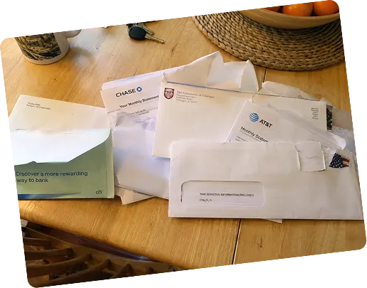 Opened envelopes and letters on a desk