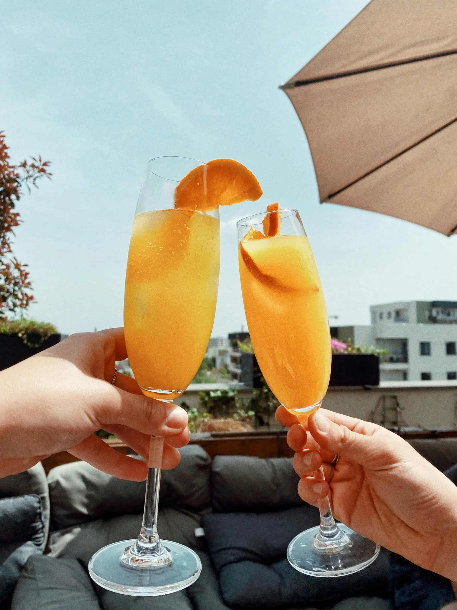 Orange drinks raised over brunch