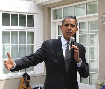 Speaker bringing his hands together