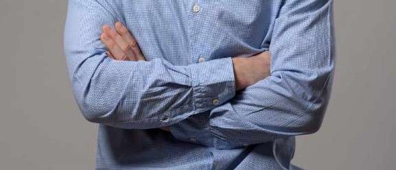 Person standing with arms crossed