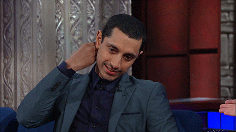Person touching their neck while speaking