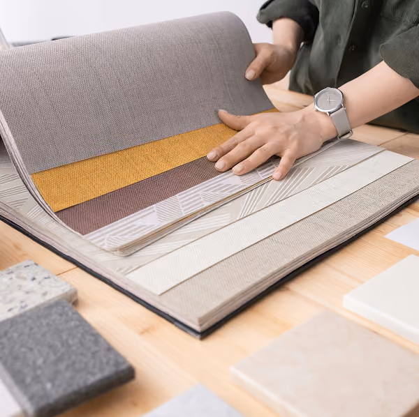 an interior designer goes through color swatches