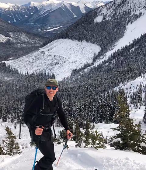 A person skis in the back country