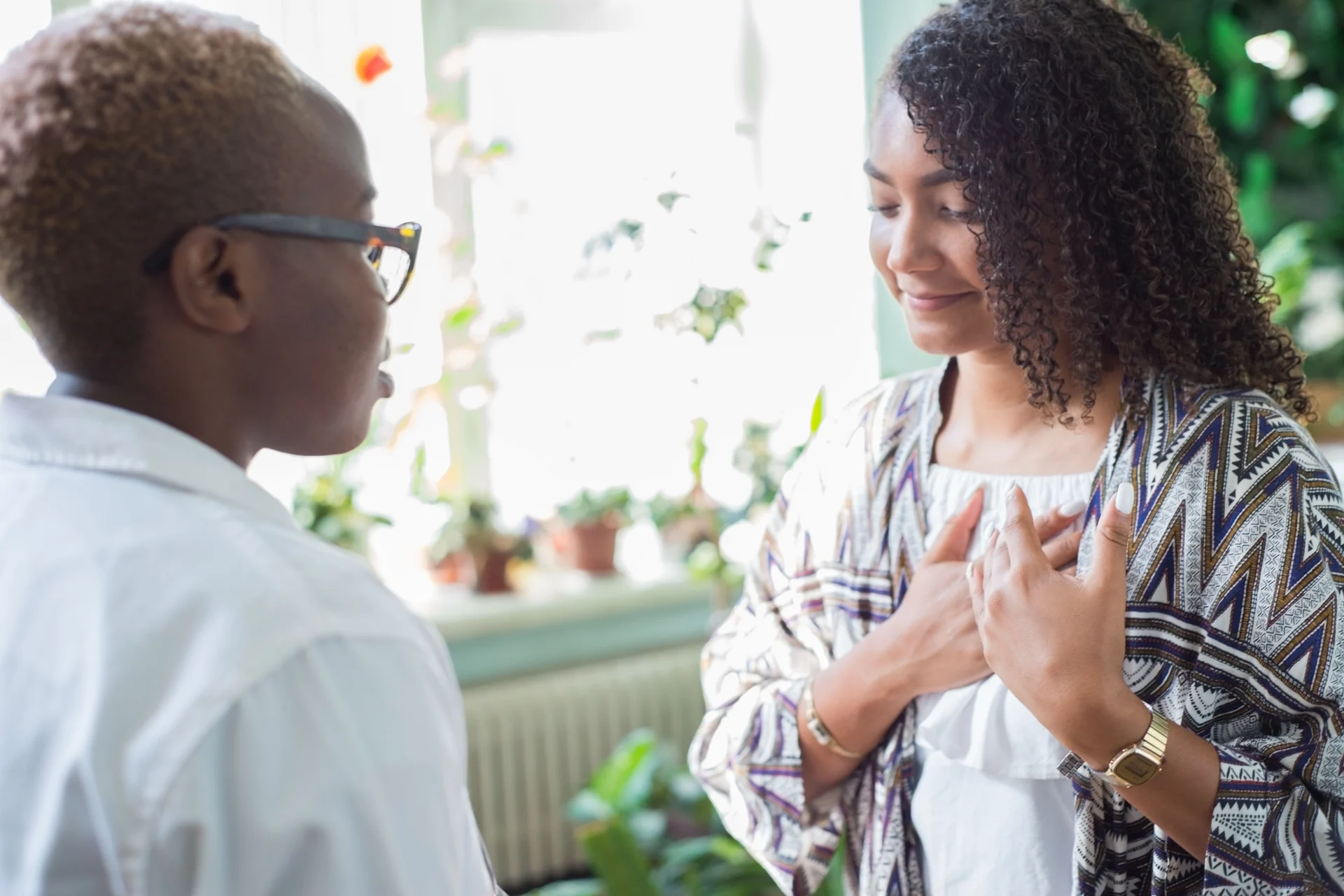 A woman discussing her heart health with a clinician