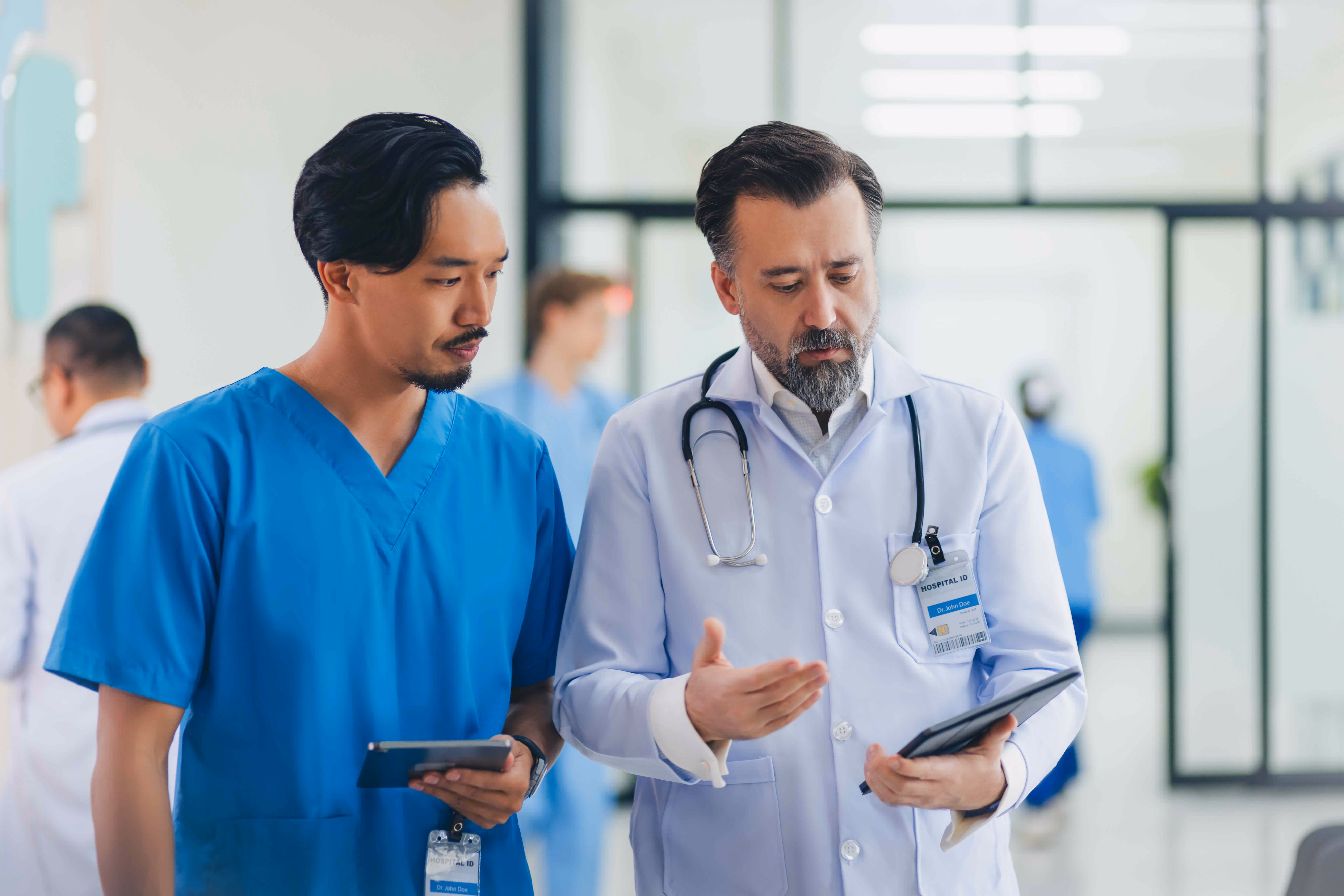 A doctor using a tablet in a clinical setting